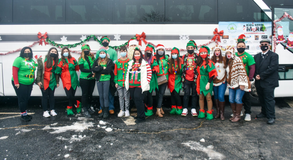 Kids Need More Hosts 6th Annual Holiday Cheer Bus Elf Ride