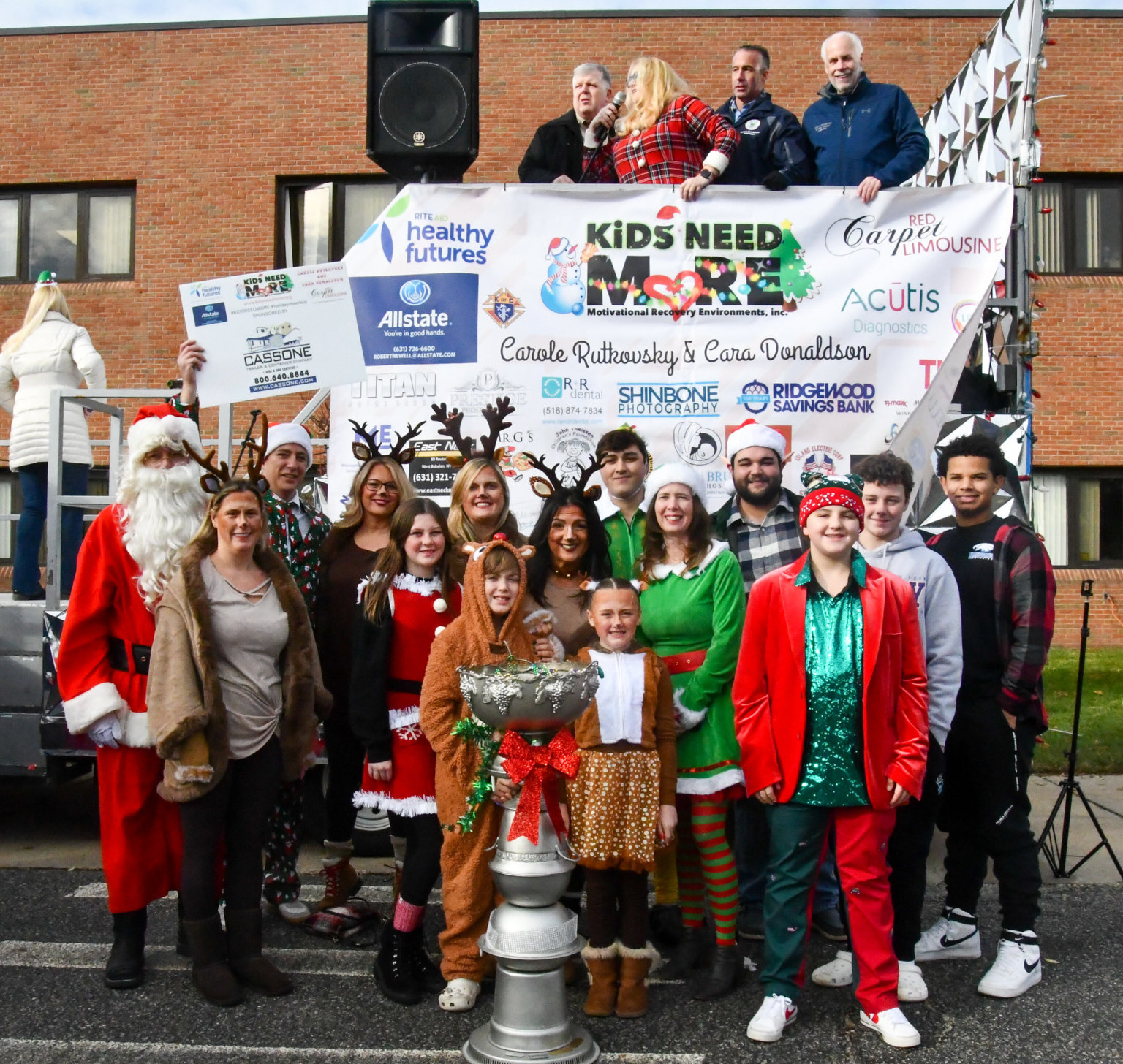 The 8th Annual Kids Need More Holiday Cheer Bus Elf Ride