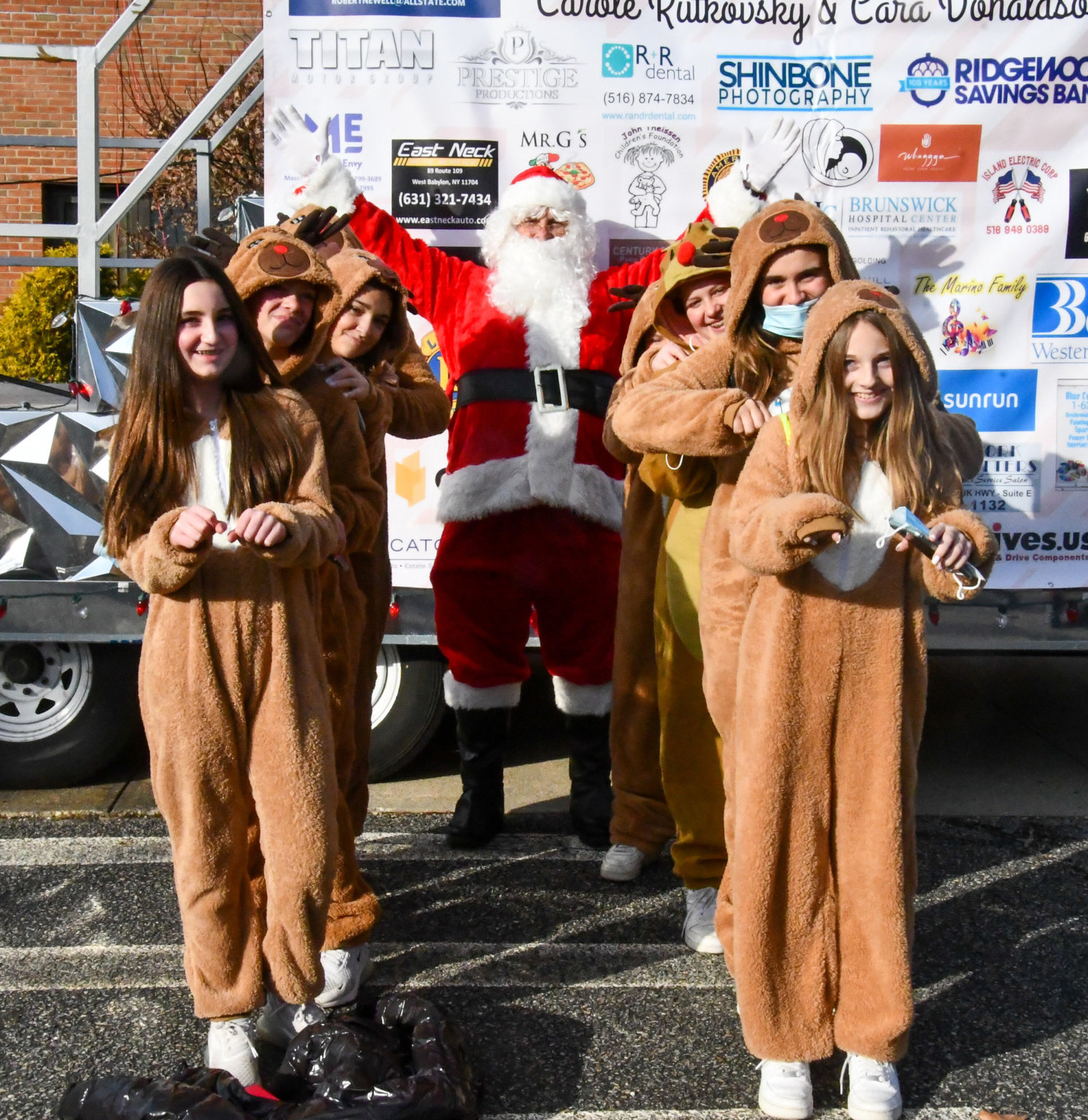 The 8th Annual Kids Need More Holiday Cheer Bus Elf Ride