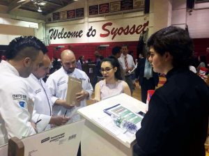 Syosset High School students representing La Casabella restaurant are advised by celebrity chefs during the school’s Compete to Eat competition.