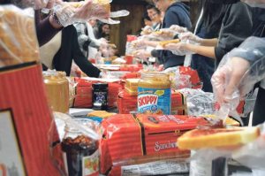 Students made peanut butter and jelly sandwiches to donate to the Family Service League of Long Island. 