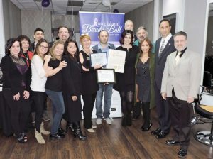 The staff at Monroe Dean Salon with their citation from the Town of Oyster Bay. 