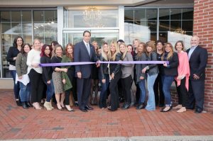 Mondays at Racine and Erika Cole employees prepare to cut the ribbon with Oyster Bay Town Clerk James Altadonna Jr.  