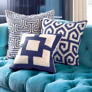 Add splashes of blue in varying patterns with these Jonathan Adler throw pillows. $135 to $200.