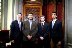 Senator Jack Martins, William McNeill, Joshua Curtis, and Prajanan Senthilkumar in the Senate Chambers during their “shadowing” experience as part of the “Students Inside Albany” Conference.