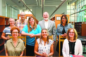 From left (back row): Trustees Christina Nadolne, Larry Greenstein, Elizabeth  Weisburd, Alan Baer and Emily Beys; front row: Vice President Nora Johnson,  President Karen Sloan and Superintendent Dr. Kathleen Mooney