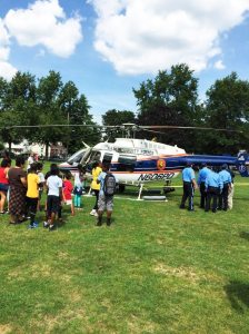 Children were delighted when a police helicopter landed on the park lawn. 