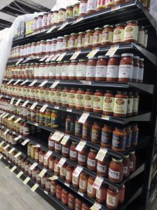 Best Market shelves are being filled in anticipation of the grand opening.