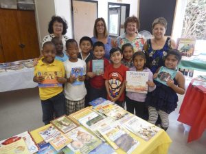 SEPTA volunteers help a summer school class find books. 