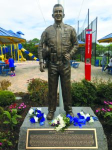 The life-size statue depicts Moore as the true hero he was. 