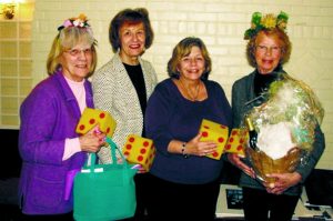 Winner Joan Jachetta, Bunco chair Eileen Duffy, president Janet Doctors and lucky Janet Schaub, who also won a basket of wine. (Photo by Dagmar Fors Karppi)