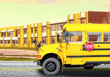 School bus in front of a school