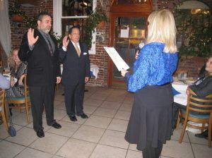 Assemblywoman Michelle Schimel administering the oath of office to chamber co-presidents Mitch Schwartz (l.) and Warren Schein at last year’s ceremony