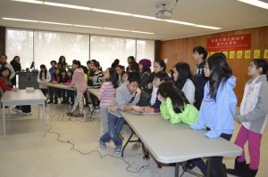 Students work in groups to learn Chinese language skills.  