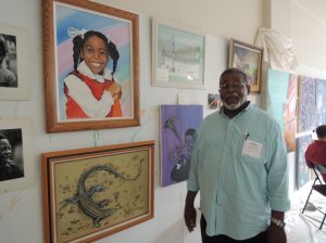 Artist George Burgess displays his work at the pop up gallery. 