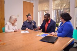 From left Judi Bosworth; Thomas Buzzita; Staff Sergeant Timothy Turane; and Gail Selig, caseworker.