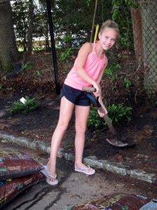 Junior Girl Scout Samantha Palmadessa helps out