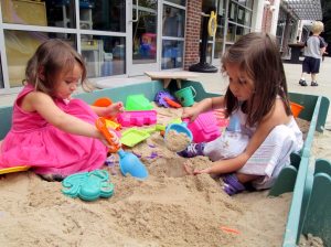 Mrs. Sullivan’s class plays in the sand. 