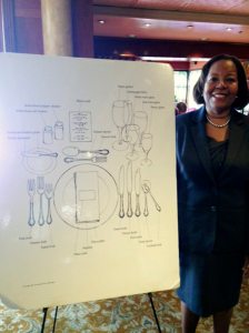 Linda WIlliams with a display on the proper place settings. 