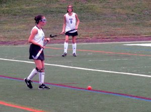 Mikayla Walsh (2) looks to make a pass as Jolie Bercow (8) looks on.