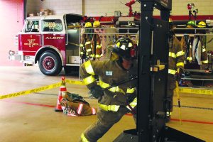 Firefighter Dago Rodriguez showed how to pry a door open using forcible entry techniques.