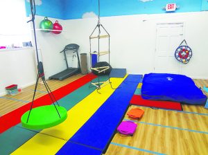 Trained physical therapists work with children at More Than A Gym.