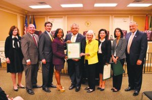 Mateo Flores (center) was honored for his work with the 