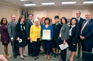 Cecilia Escamilla pictured with Town Supervisor Judi Bosworth, Town Clerk Wayne Wink, Councilwoman Viviana Russell, Councilman Peter Zuckerman, Councilman Angelo Ferrara, Councilwoman Anna Kaplan, Councilwoman Lee Seeman and Councilwoman Dina De Giorgio