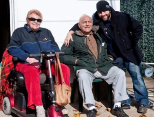 Jonathan Ehlers with his grandparents Betty and Mike Sternberg from Carle Place. Ehlers used their home as the base of operations while filming Ink and Steel. 