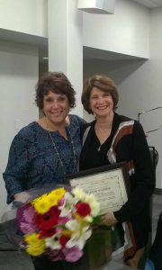 Great Neck Library Board of Trustees President Marietta DiCamillo (left) presented outgoing Secretary Varda Solomon with a certificate of appreciation and flowers at the Jan. 17 Board of Trustees meeting.