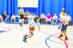 At left, Ethan Hofman of the Sid Jacobson Maccabi Team