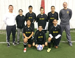 The soccer team at Mill Neck Manor School for the Deaf competed in the Oct. 21-22 ESDAA Tournament in Rochester. In the front: Keren Guerra, Noel Rodriguez and Kevin Canales. In back: Coach Larry Manning, Nataly Osorio, Julio Reyes, Bianca Llorens, Jose Yanes and Coach Tony Albicocco.