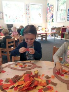 Student Natalie making leaves