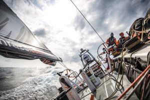 February 10, 2015. Leg 4 to Auckland onboard Team Alvimedica. Day 2. A brief moment of sunshine for Seb Marsset (L) and Nick Dana (R), hammering upwind in 25 knots with one reef in the main.