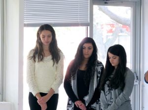 Caroline Crimmins, Hallie ArbitalJacoby and Ariana Arralde mourn the death of Emily Webb during an Our Town rehearsal.