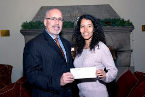 Marc Gann, Esq., a member of the Nassau County Bar Association  We Care Fund, gives grant to Leila Noor, director of development for the  Port Washington Parent Resource Center. 