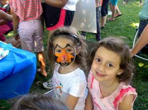 Children with their faces painted at last year’s Party in the Park.