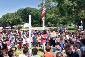 Students gather around the Peace Pole and listened as principal Ronelle Hershkowitz stressed the importance of being inclusive of everyone.