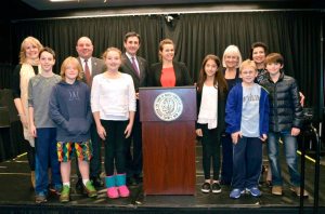 Councilman Zuckerman, Gold Coast Arts Center Executive Director Regina Gil and Supervisor Bosworth enjoy the recycled art gallery which town officials with the middle school category winners