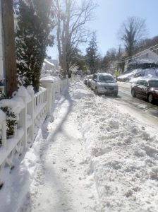 This patch of Roslyn Road was shoveled, but it remained covered with snow.