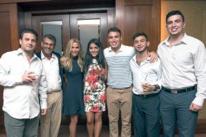 Golf and Tennis Outing honorees Paul Davidson and Staci Leavitt Davidson, second and third from left, and their family gathered to celebrate.