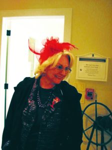 Eight Red Hat Society members attended the talk. Annamarie Gryzlo wore a red fascinator. 