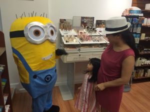 This child follwed the minion, who was planning to take a break in the store.