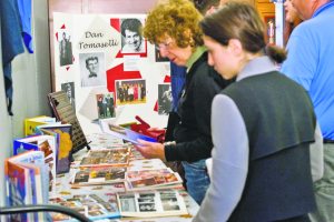 At a reception before the ceremony, attendees viewed memorabilia highlighting Dan Tomaselli’s contributions to music and drama at North Middle School.