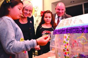 North Hempstead Supervisor Judi Bosworth and Councilman Peter Zuckerman view recycled art creations.