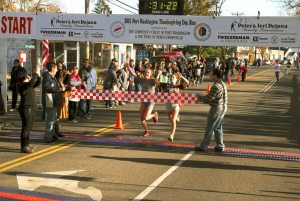 Joelle Feinberg and Alexis Van Pernis, crossing the finish line as #1 and #2.