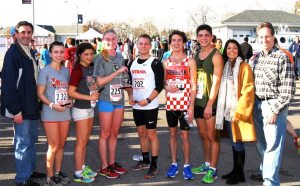 Town Clerk Wayne Wink, winners Bianca Luparello (3rd place, women), Joelle Feinberg (1st place, women), Alexis Van Pernis (2nd place, women), Marco Bertolotti (1st place, men), Taylor Titcomb (2nd place, men), Aaron Siff-Scherr (3rd place, men), Town Councilperson Dina DeGiorgio and Community Chest President Neil Lazar