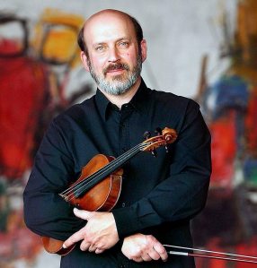 Gerald Elias, violinist with the Utah Symphony, poses at Abravanel Hall on December 2, 2004.