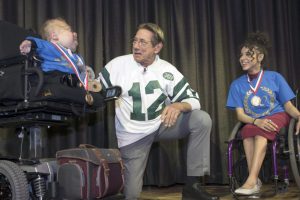 Joe Namath (center) with Viscardi seniors Christopher Alvarez and Mariah Sepulveda