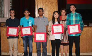 Floral Park students Thomas Von Holten, Dev Patel, Kyle Sahadeo, Weiting Zhang and David Talero were honored for scoring a level 2 on the Spanish National Exam. They are pictured with Principal Dr. Kathleen Sottile.